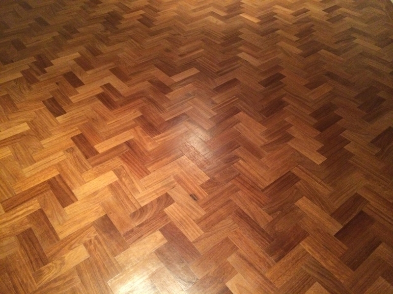 Dark stained hardwood floor with high-gloss finish