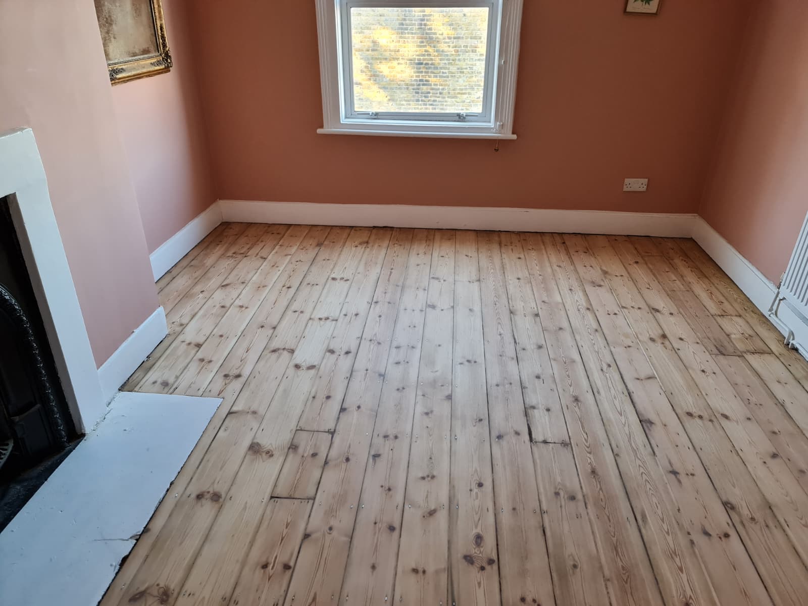Engineered wood floor refinished in modern apartment